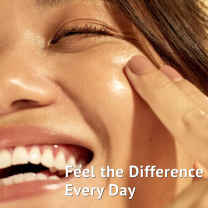 Woman with naturally glowing skin applying moisturizer during her daily skincare routine for healthy and hydrated skin.