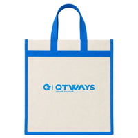 Natural canvas tote bag with bright blue handles and blue edge trim, featuring the QTWAYS logo and the tagline "Unveil Yourself" printed in blue on the front. The bag has a simple, reusable shopping tote design with an open top