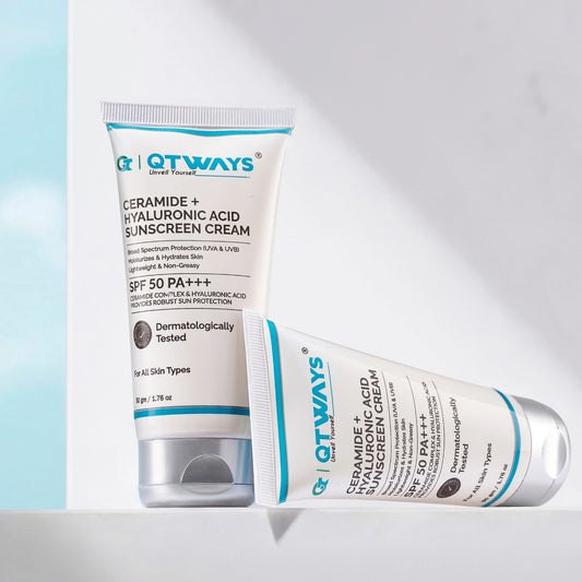 Two tubes of Qtways Ceramide and Hyaluronic Acid Sunscreen SPF 50 PA++++ displayed in a minimal setting, showcasing a lightweight, non-greasy daily sunscreen with broad spectrum UVA and UVB protection for all skin types.