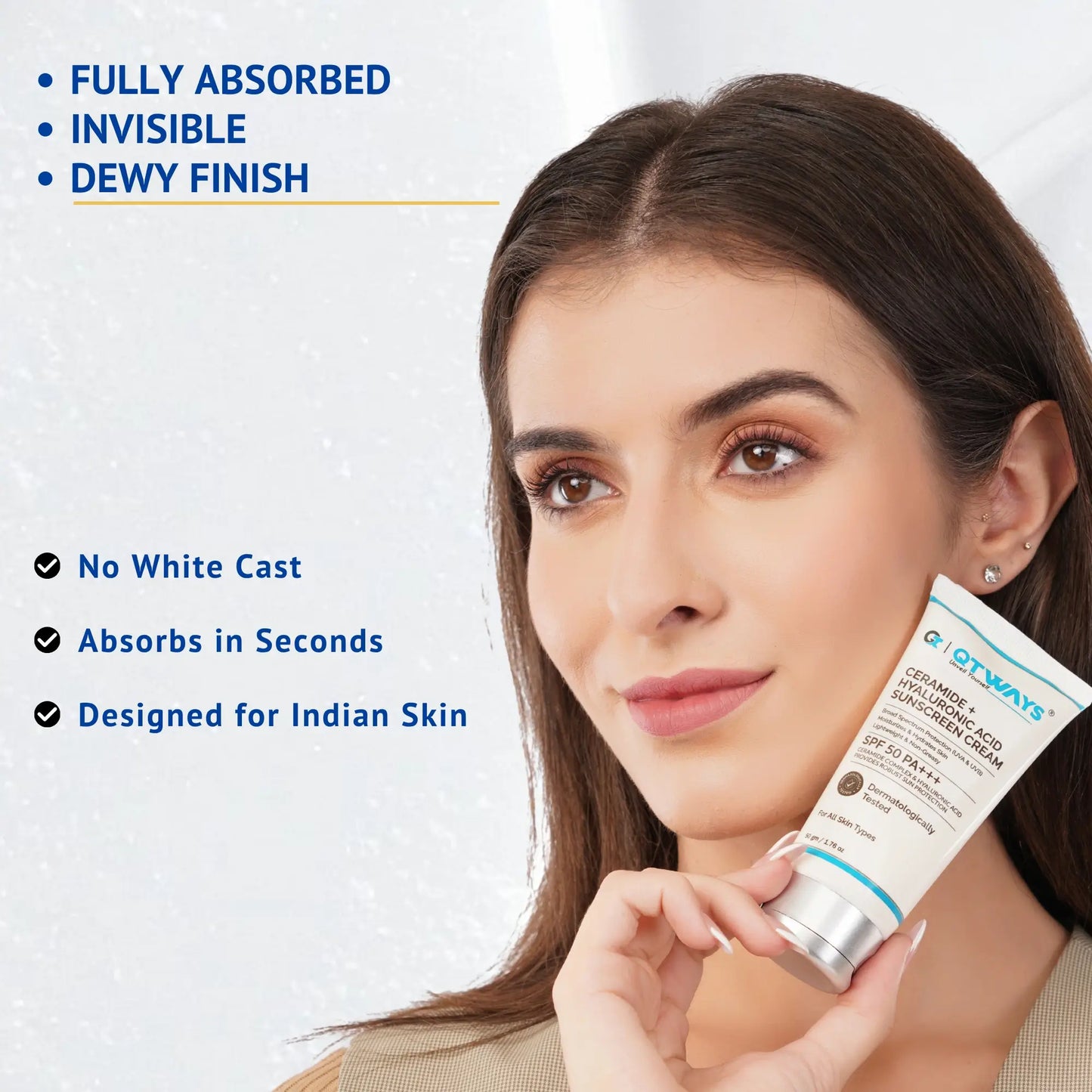 Model holding QTWAYS Ceramide + Hyaluronic Acid Sunscreen SPF 50 PA++++ highlighting no white cast, fast absorption, dewy finish, and lightweight formula designed for Indian skin.