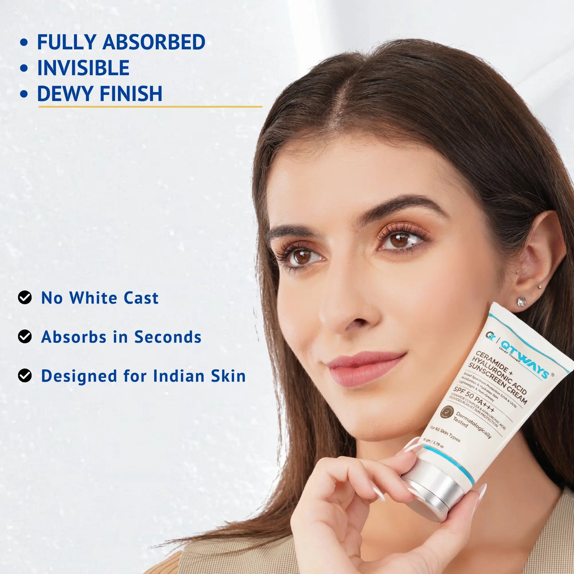 Model holding QTWAYS Ceramide + Hyaluronic Acid Sunscreen SPF 50 PA++++ highlighting no white cast, fast absorption, dewy finish, and lightweight formula designed for Indian skin.