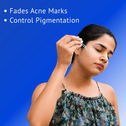 Woman applying QTWAYS 10% Niacinamide + 1% Kojic Acid + Vitamin B5 Face Serum with a dropper to help fade acne marks, control pigmentation, and improve overall skin clarity.